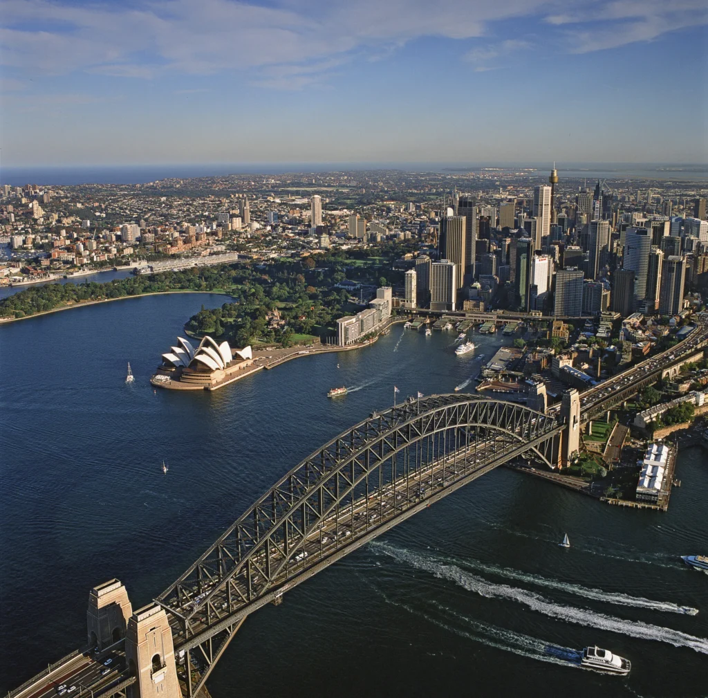 Aerial view of Sydney skyline featuring the Harbour Bridge and Opera House